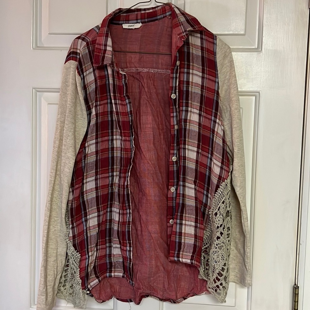 Oddy. Flannel type shirt with red, light blue, and tan colors.